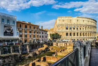 pexels-photo-532263-532263 Daylight view of the historic Colosseum in Rome with vibrant city buildings.